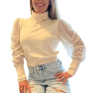 Charmed Hearts cream turtleneck with sheer sleeves